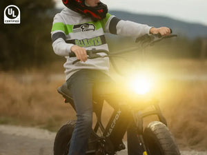 The boy started his Macfox electric bicycle and prepared to go out.