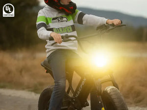 The boy started his Macfox electric bicycle and prepared to go out.