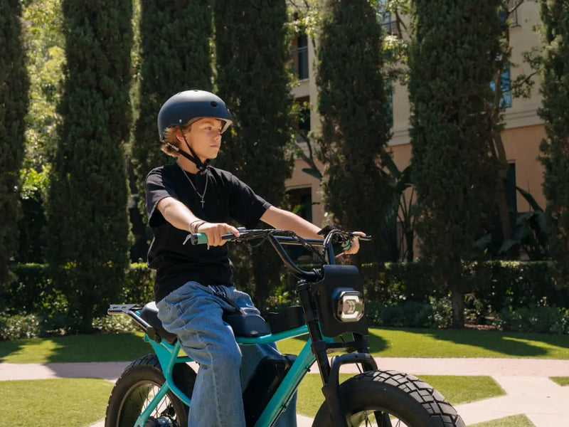 younger rider riding on grass area, Macfox X7 electric bike