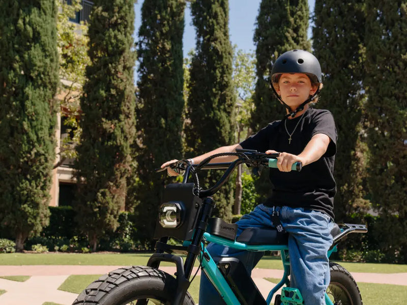 younger rider riding on paved area, Macfox X7 electric bike