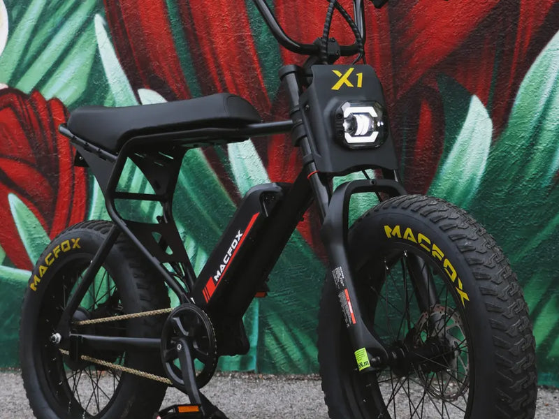 Macfox X1S eBike with removable battery, highlighting the charging setup and frame design