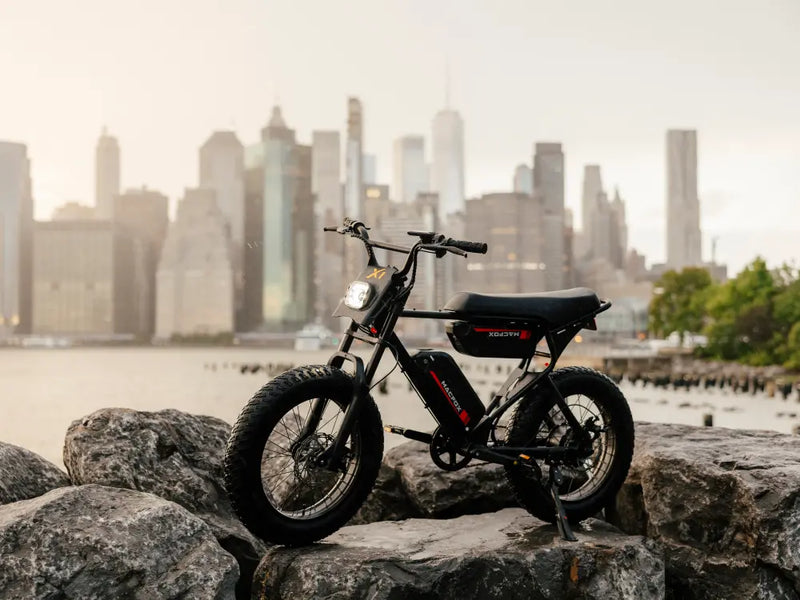 electric bike parked on rocks near water, Macfox X1S electric bike