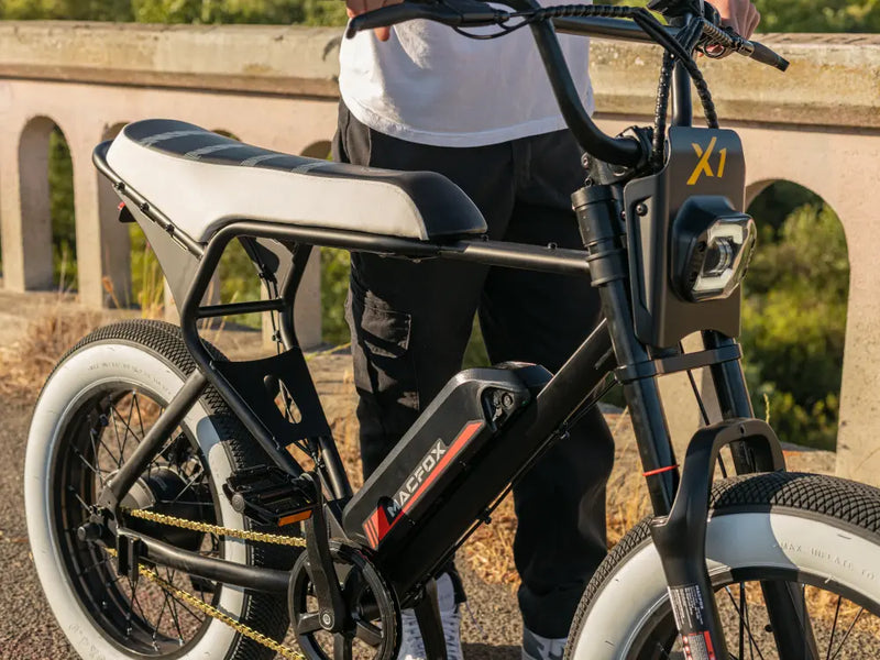 Macfox X1S commuter eBike parked beside a scenic bridge overlook