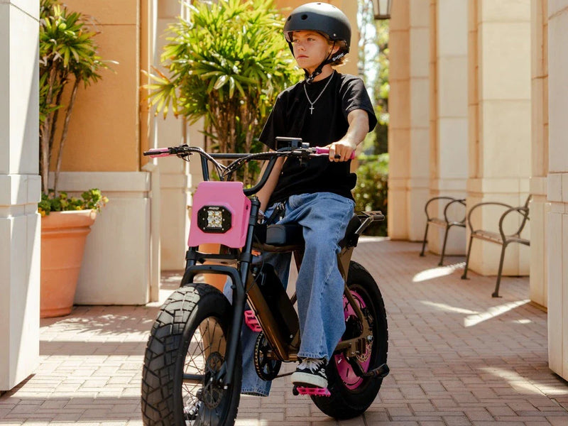 Teen riding Macfox X7 Fat Tire Mountain Electric Dirt Bike, designed for stability and youth independence