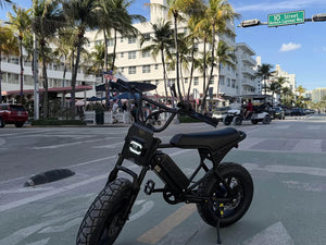 Macfox M16 electric bike in a lifestyle photo.
