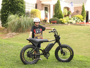 A helmeted rider standing behind a side-on Macfox X7 eBike.