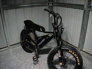 Macfox X7 black electric bike in a dark outdoor lifestyle scene.