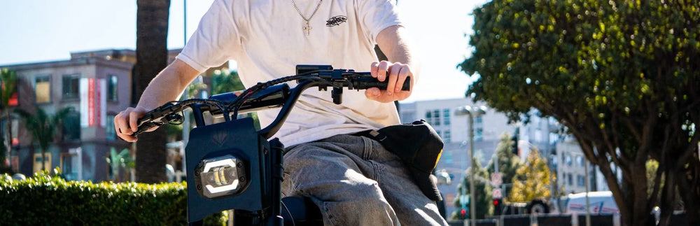 A rider is seen riding a Macfox X1S dual-battery electric bicycle on the street.