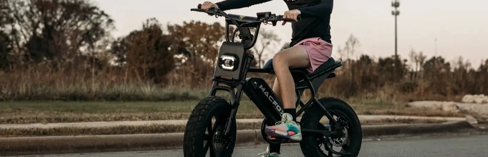 The boy was riding a Macfox M16 Mini Small E-bike